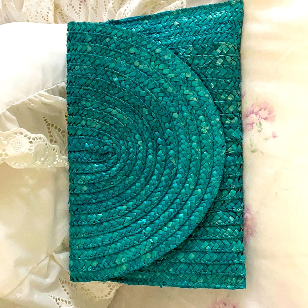 Turquoise straw clutch bag